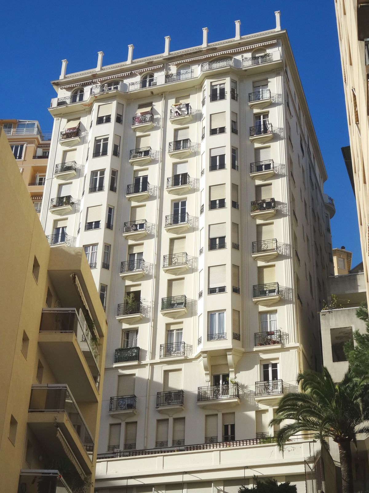 Exterior view of Palais Miami, showcasing its luxurious design and premium location in Monaco.