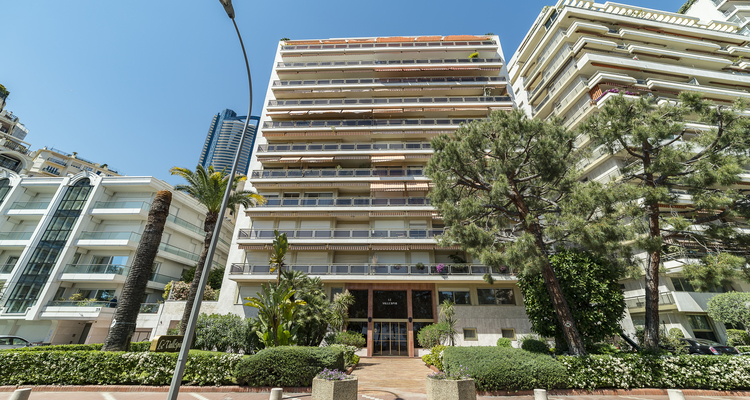 Exterior of Vallespir building in Monaco’s Larvotto district, showcasing modern architecture and balconies with sea views.