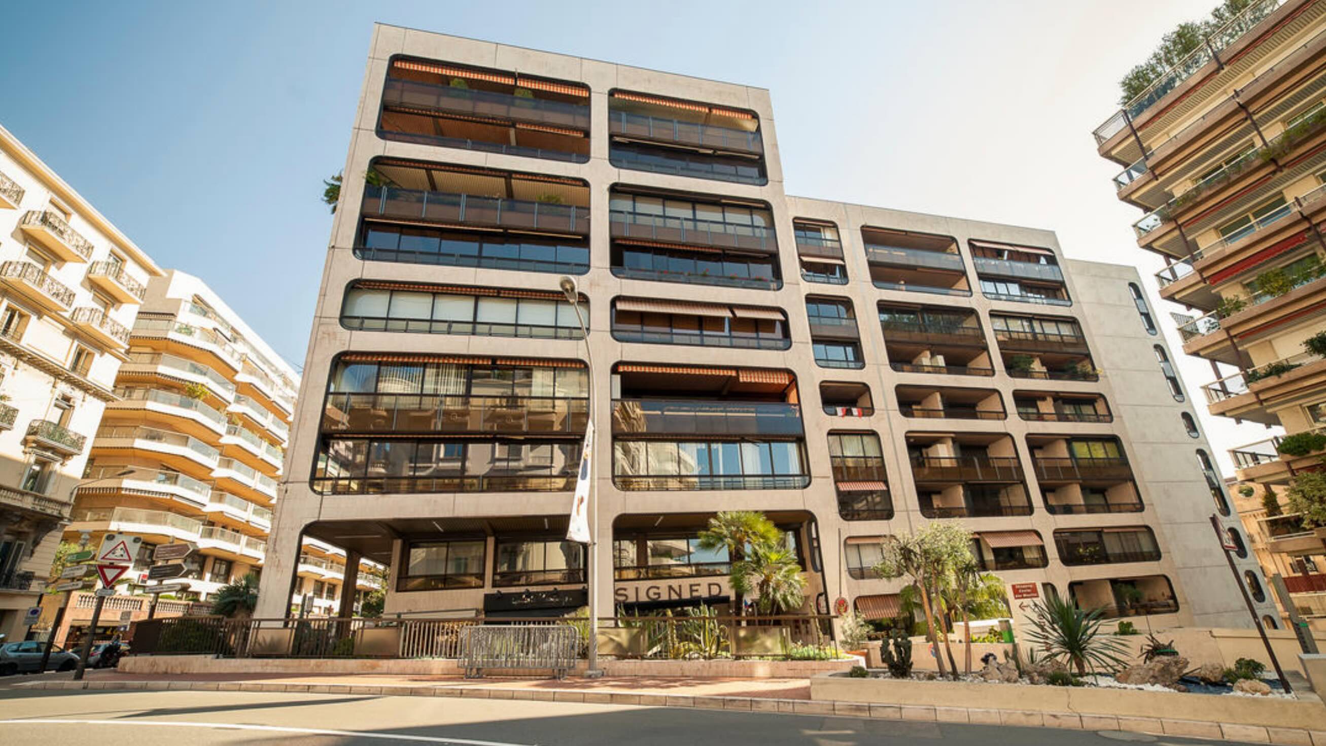 Luxury residential building Montaigne in Monaco’s Carré d'Or, offering modern architecture, spacious apartments with loggias, 24/7 concierge service, and prime access to high-end shopping and dining