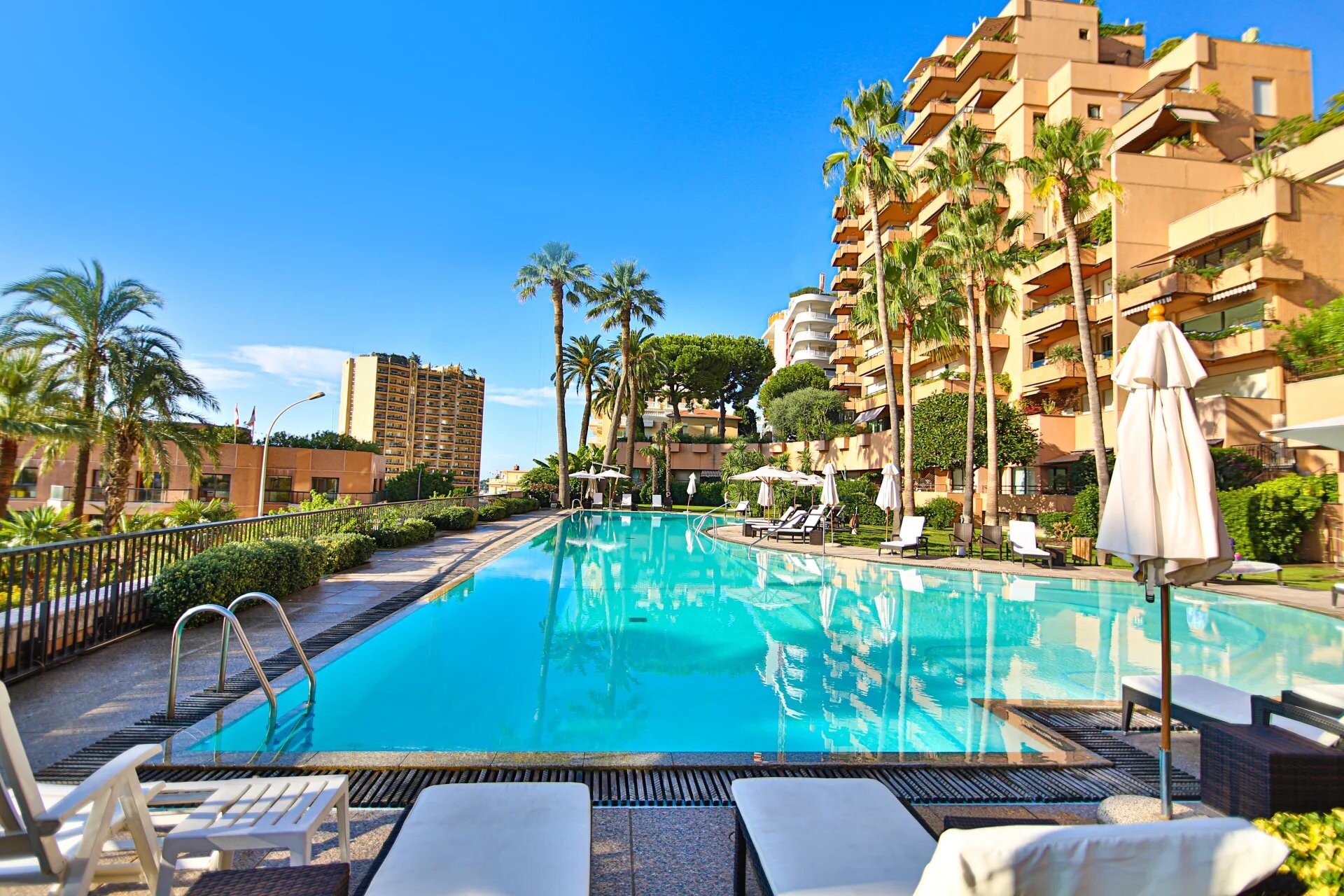 Exterior view of Parc Saint Roman in Monaco, showcasing its 33-story modern design.