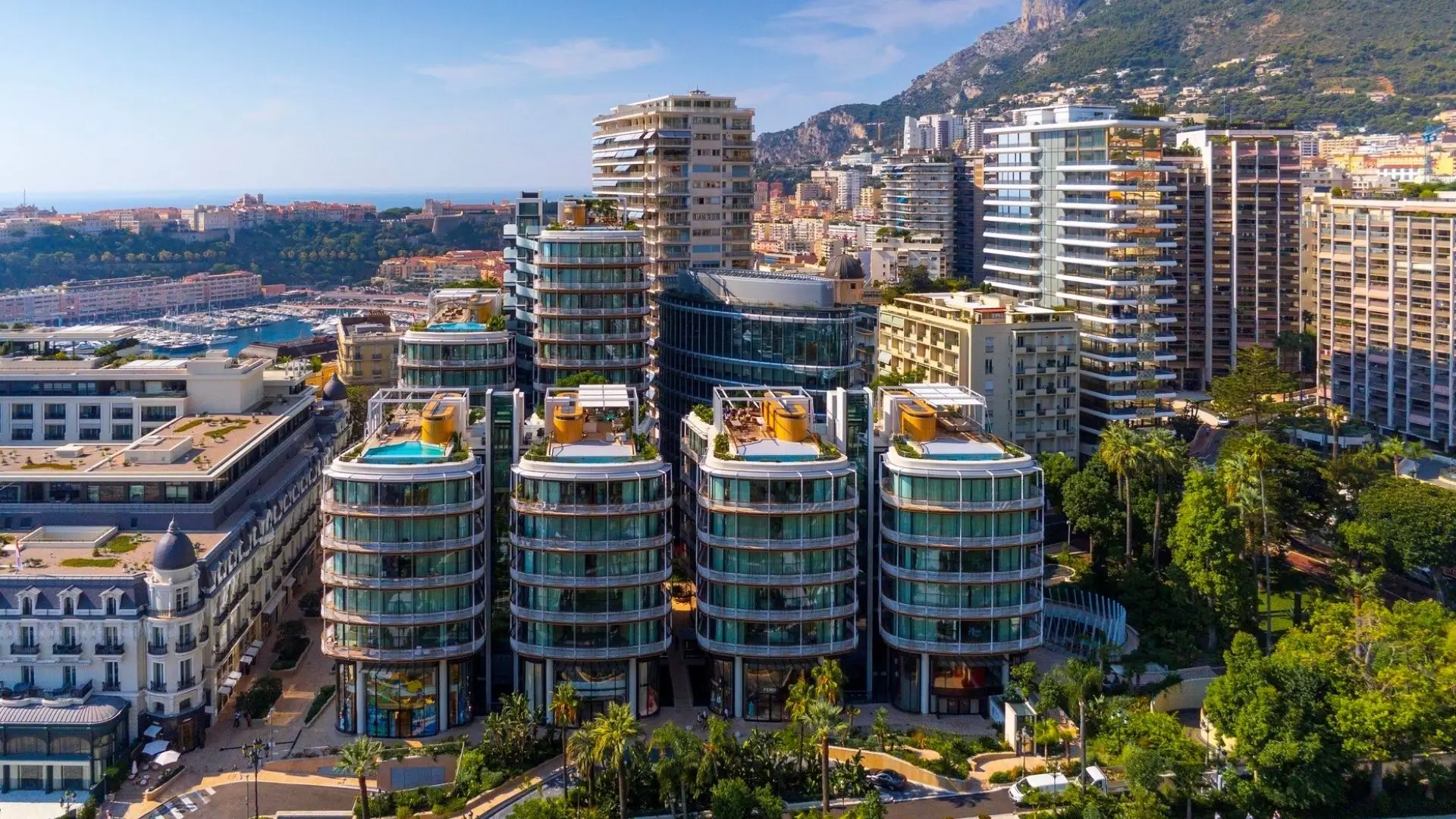 The One Monte-Carlo buildings with luxury shops, overlooking Port Hercule and the Hôtel de Paris.